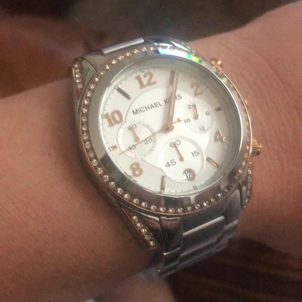 Micheal Kors silver and rose gold watch.